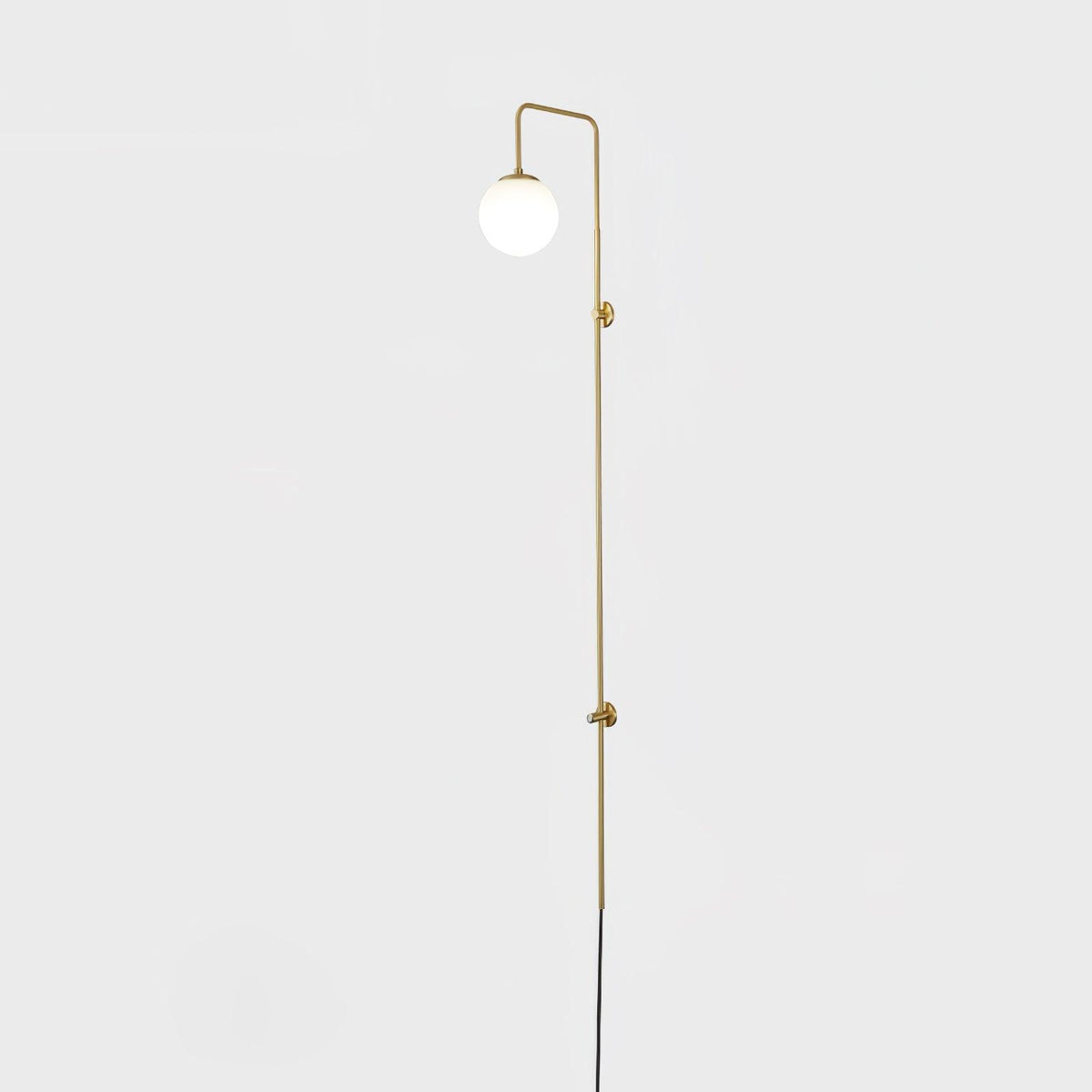 Solenne Globe Brass Plug-in Wall Sconce